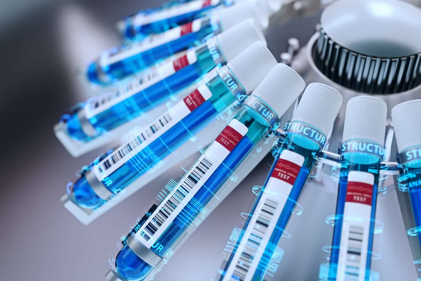 Lab tubes with blue liquid in them centrifuging